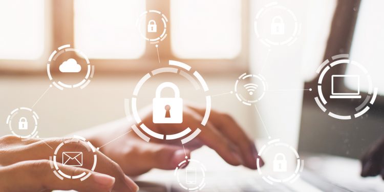 Businessman working on laptop. Protection network security computer and safe your data concept. Digital crime by an anonymous hacker