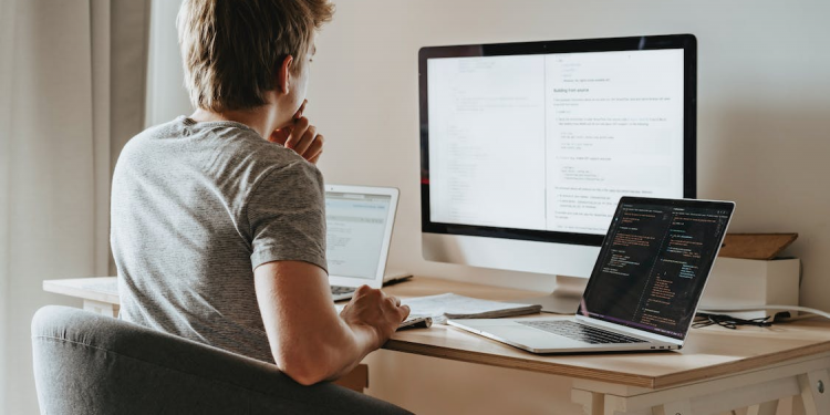 A man researching data on computers